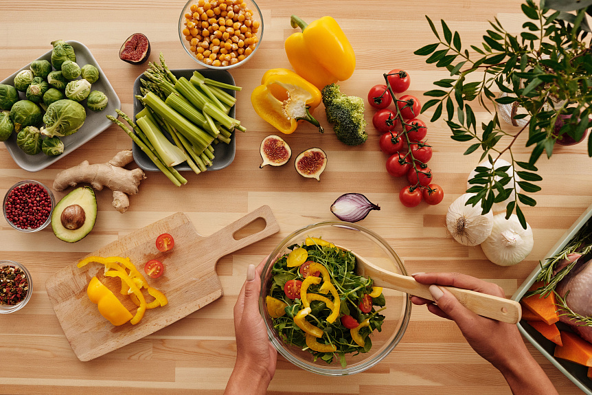 Fresh seasonal vegetables and cooling herbs representing an Ayurvedic Pitta-balancing diet for summer wellness