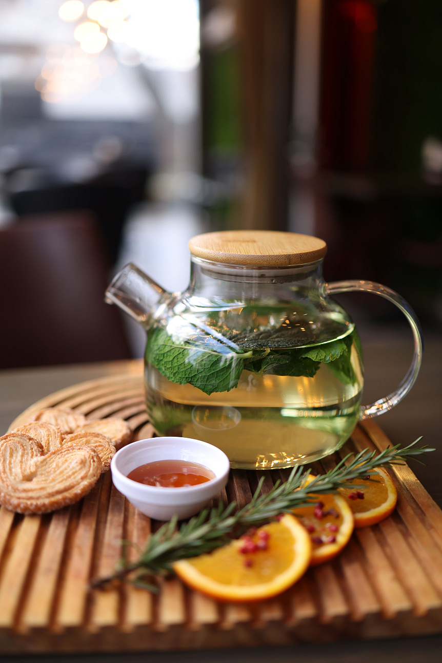 Photo of warm mint tea in a glass cup maintaining the internal balance of the pitta dosha