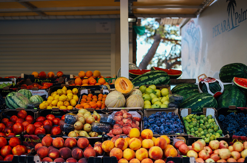 Photo of fresh summer fruits on a wooden board harmonizing the diet with ayurvedic summer nutrition