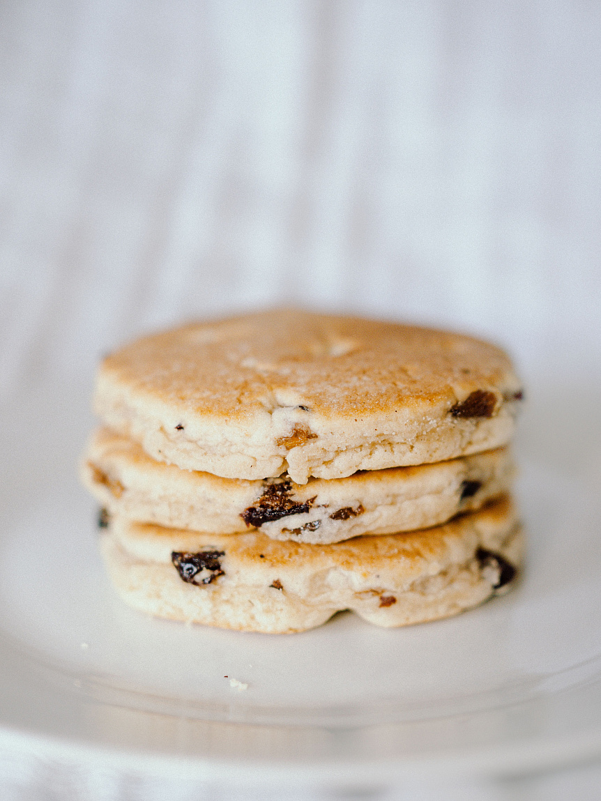 Food photography of golden millet patties served on a ceramic plate as a healthy Kapha balancing breakfast